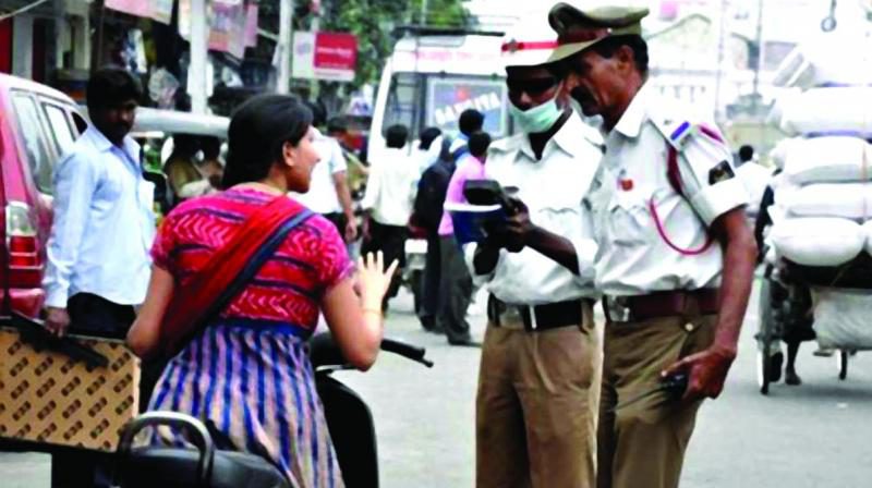 Rajamahendravaram: Traffic Cops On Duty Stay Glued To Mobile Phones